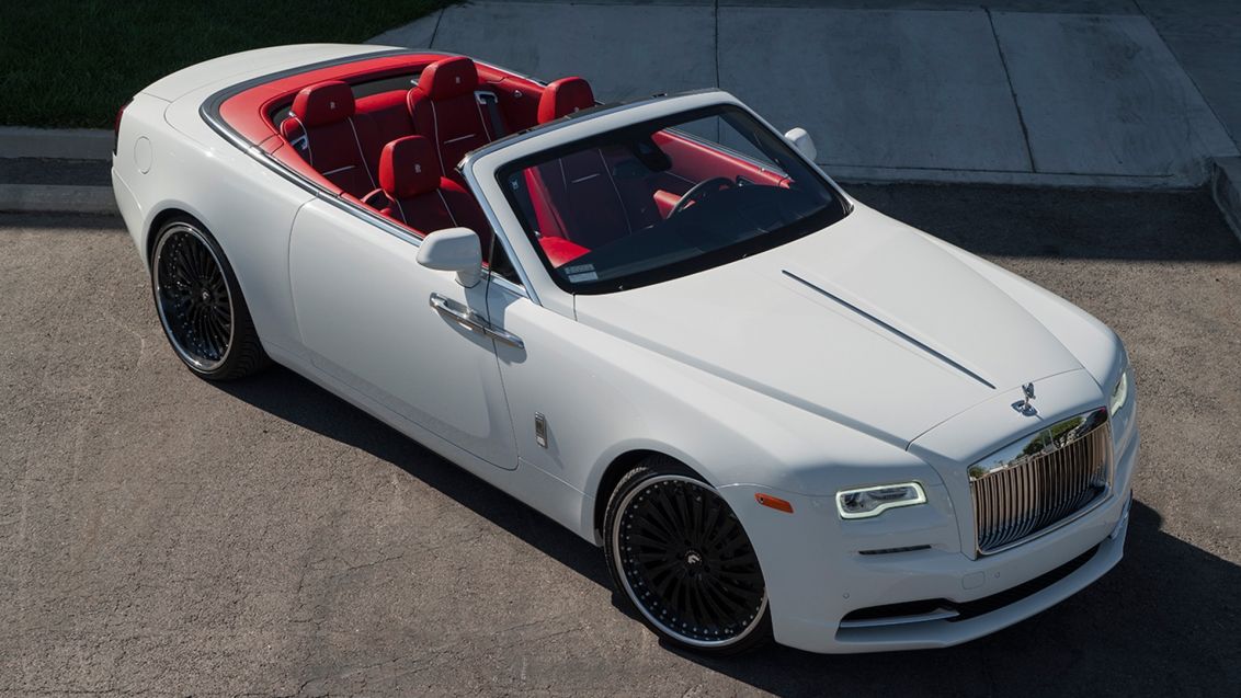 White Rolls Royce with red interior.